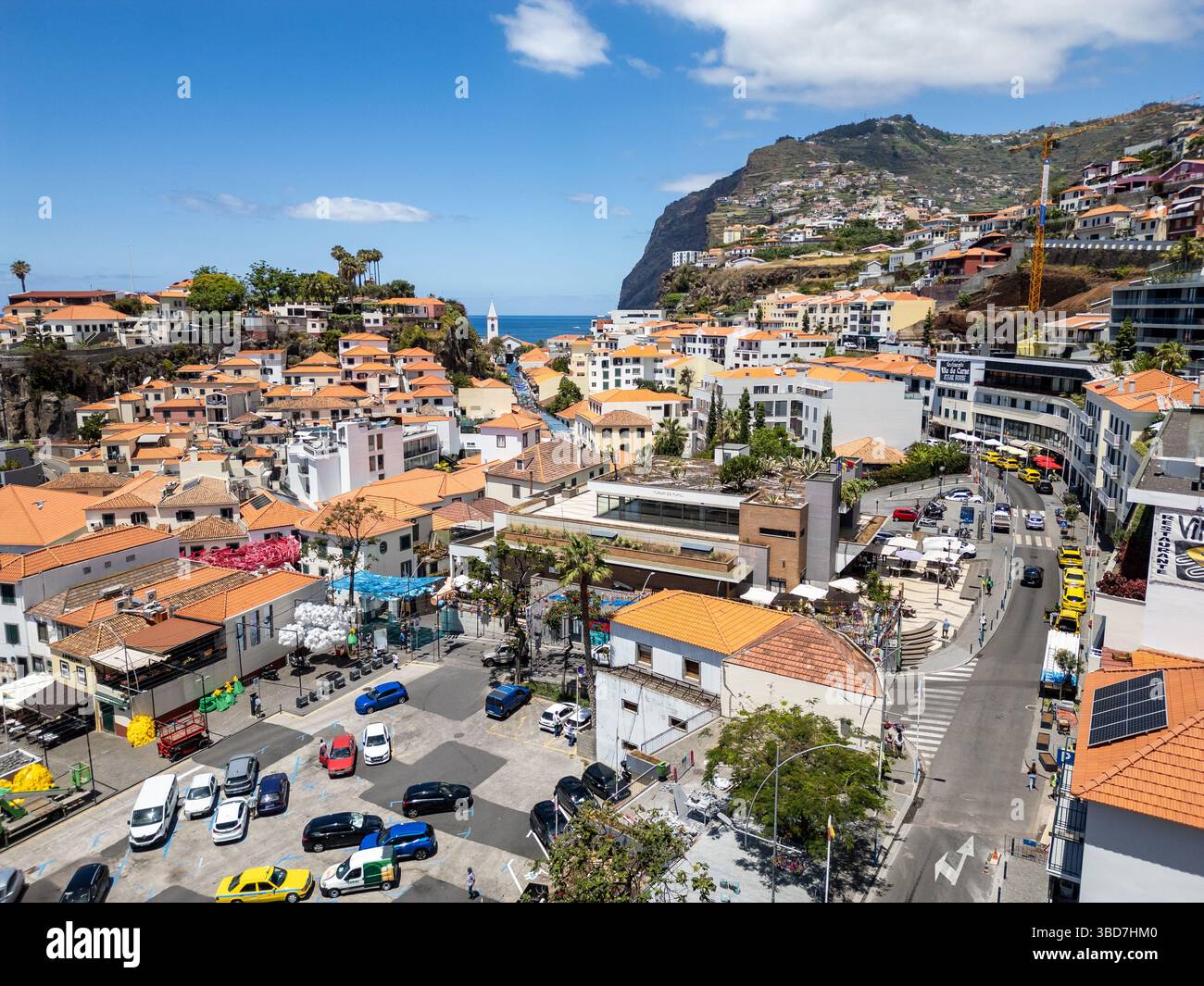 Camara de Lobos, Portugal - June 11, 2024: Aerial view of Camara de Lobos on Madeira Island. Cabo Girao cliff on background Stock Photo