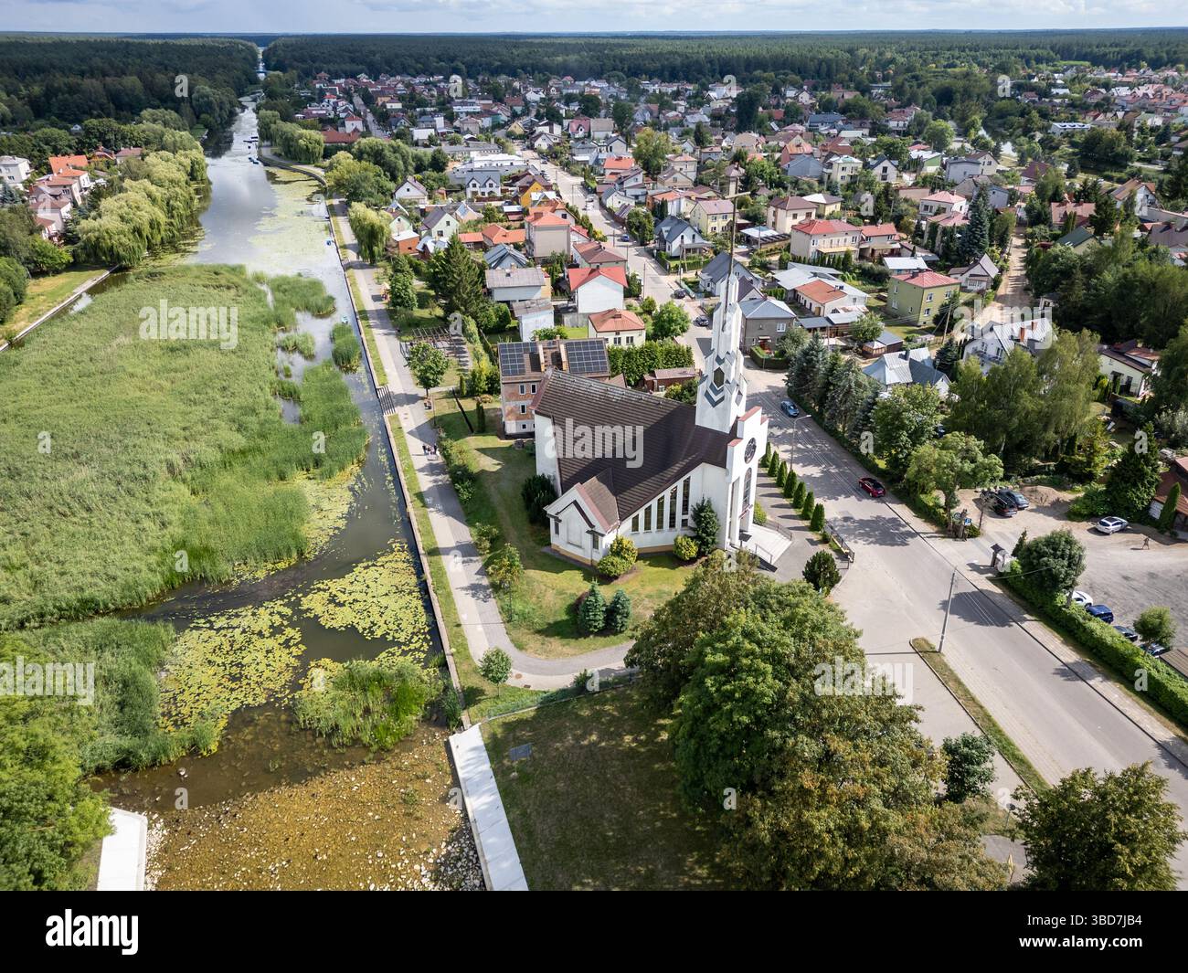 Augustow city on the Netta River and Augustow Canal, Podlaskie region, Poland. View with Church of Divine Mercy Stock Photo