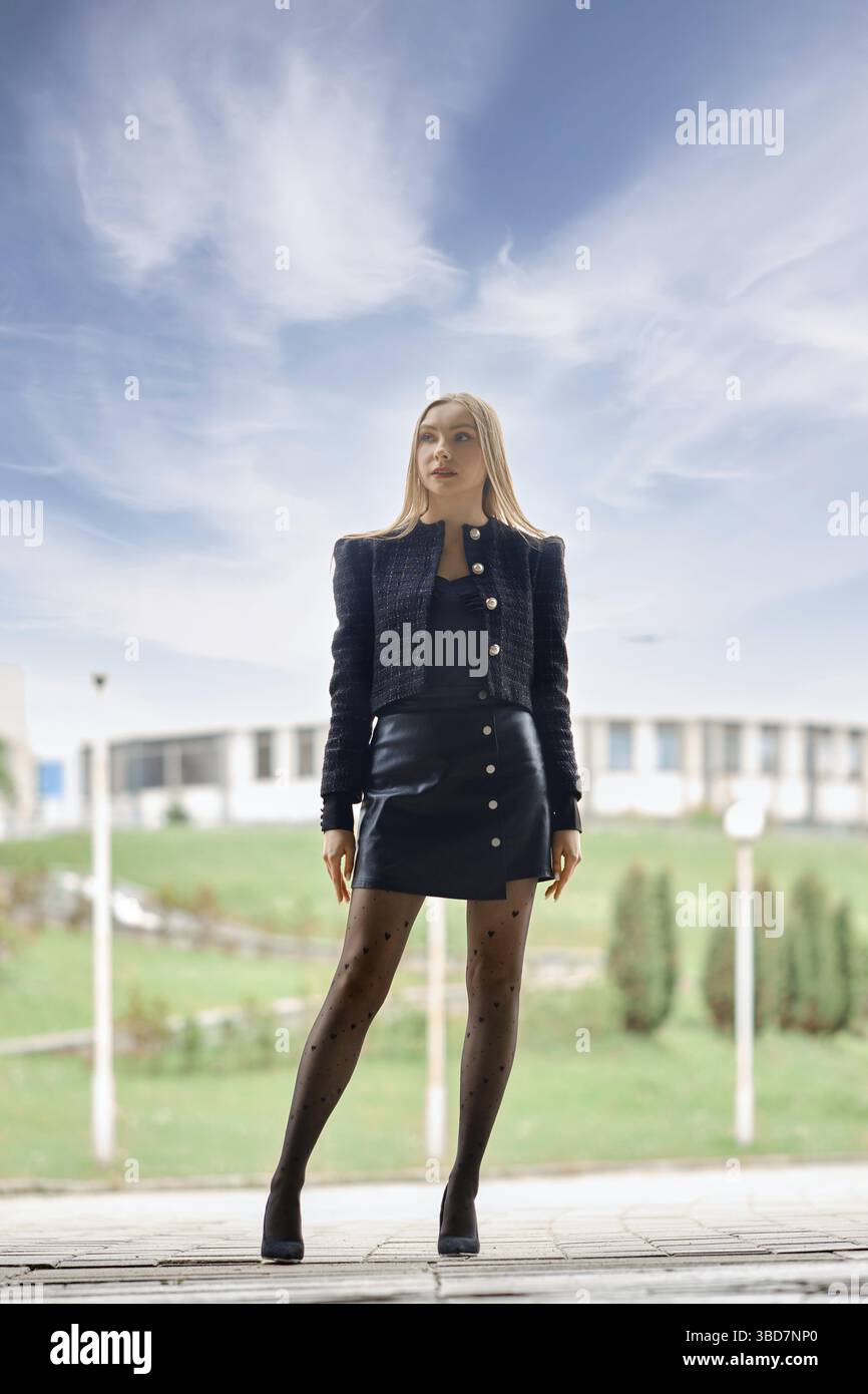 Full length urban portrait of confident woman outdoors Stock Photo