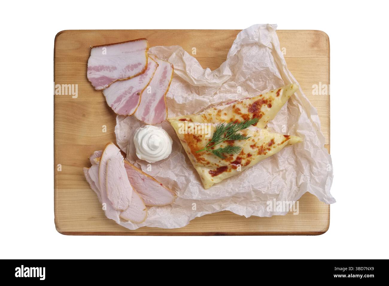 Thin pancakes stuffed with ham and bacon isolated on white Stock Photo