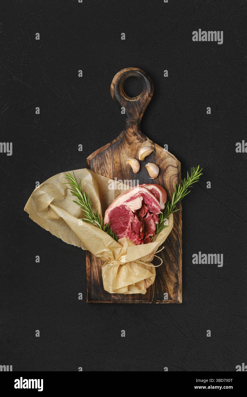Raw fresh lamb double loin chop wrapped in paper Stock Photo