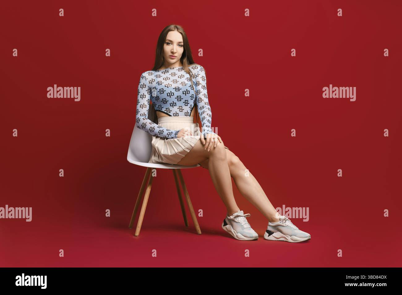 Woman sitting chair full length hi-res stock photography and images - Alamy