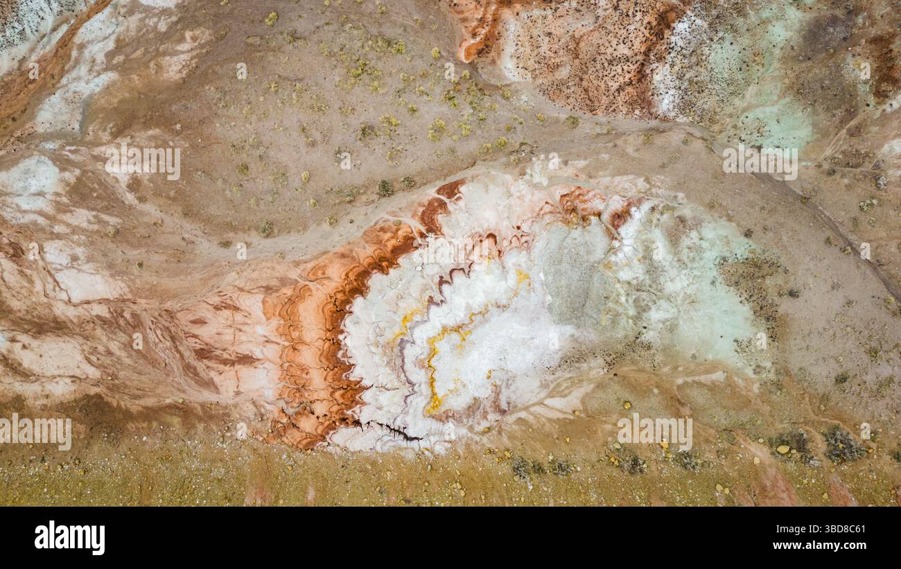 Aerial view of swirling red, white, and yellow mineral formation Stock ...