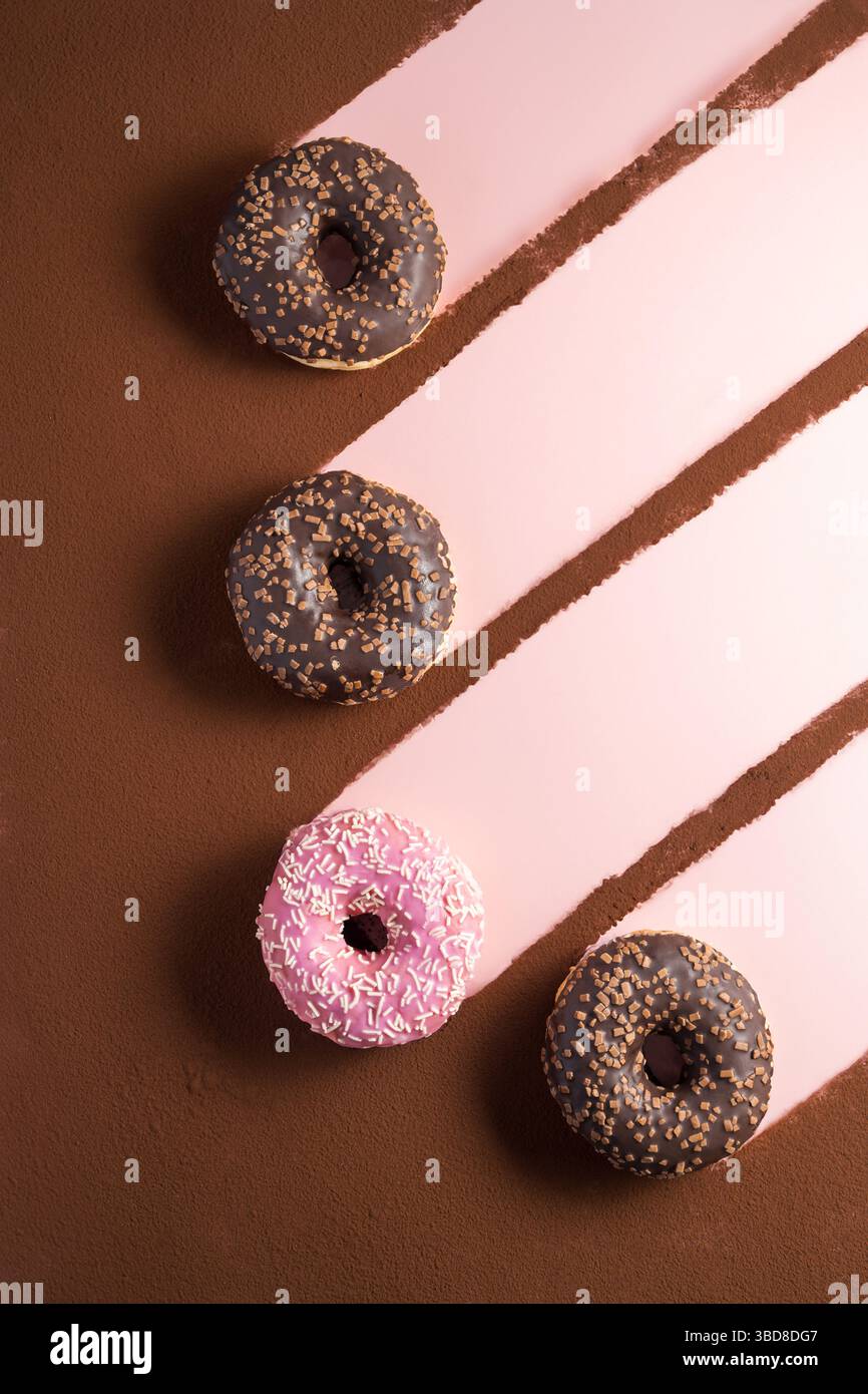 Abstract isolated donuts on pink background Stock Photo