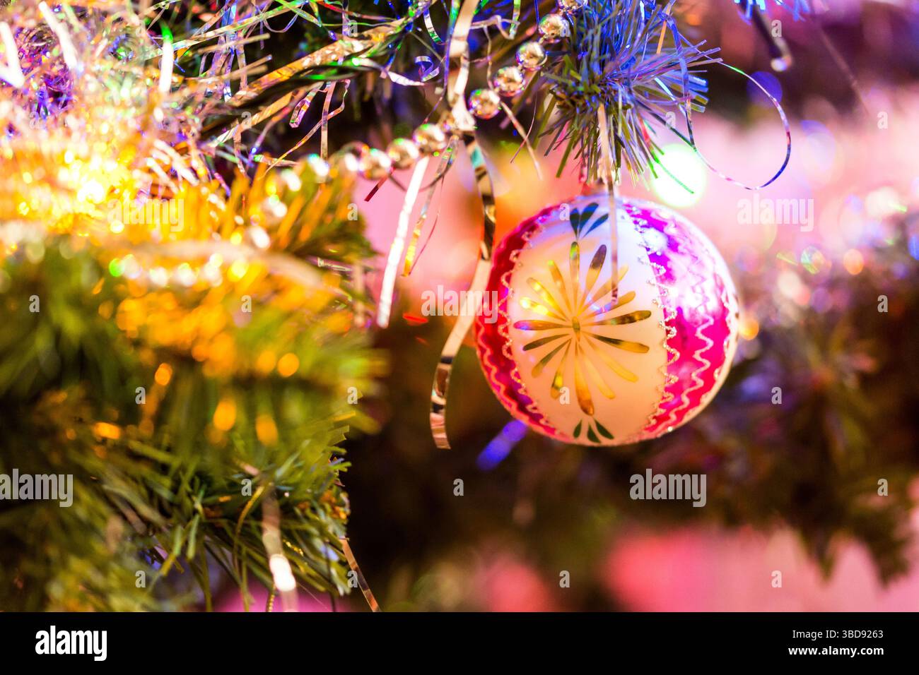 Detail of christmas decoration hangs on the tree. Christmas tree with pink, gold color and christmas ball Stock Photo