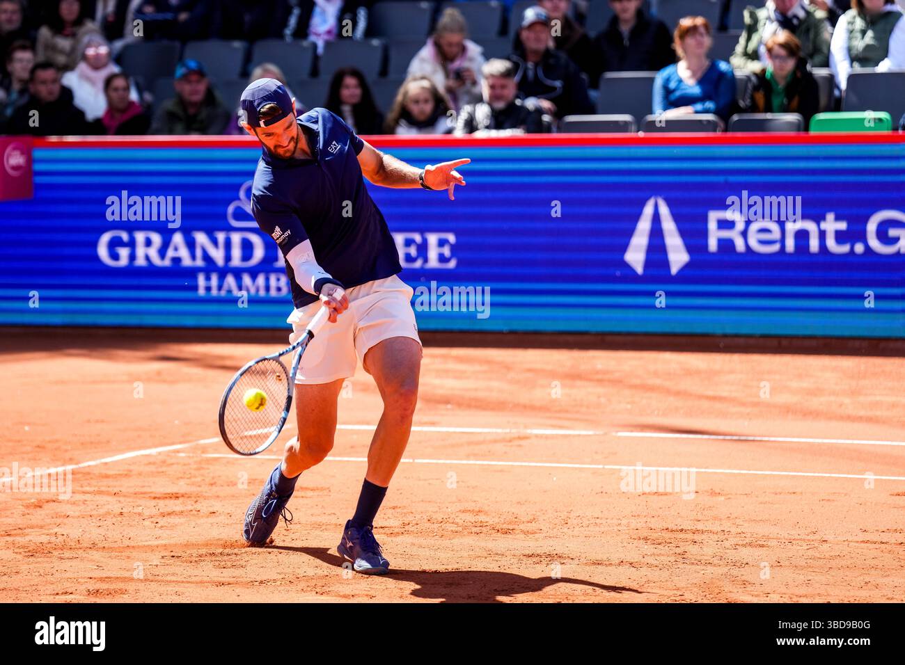 HAMBURG, GERMANY - MAY 23: Andrea Vavassori of Italy plays a forehand in his Men's Doubles Semi Final match with Simone Bolelli of Italy against Joe Salisbury of Great Britain and Neal Skupski of Great Britain during Day Seven of the Bitpanda Hamburg Open at Am Rothenbaum on May 23, 2025 in Hamburg, Germany. (Photo by Rene Nijhuis) Stock Photo