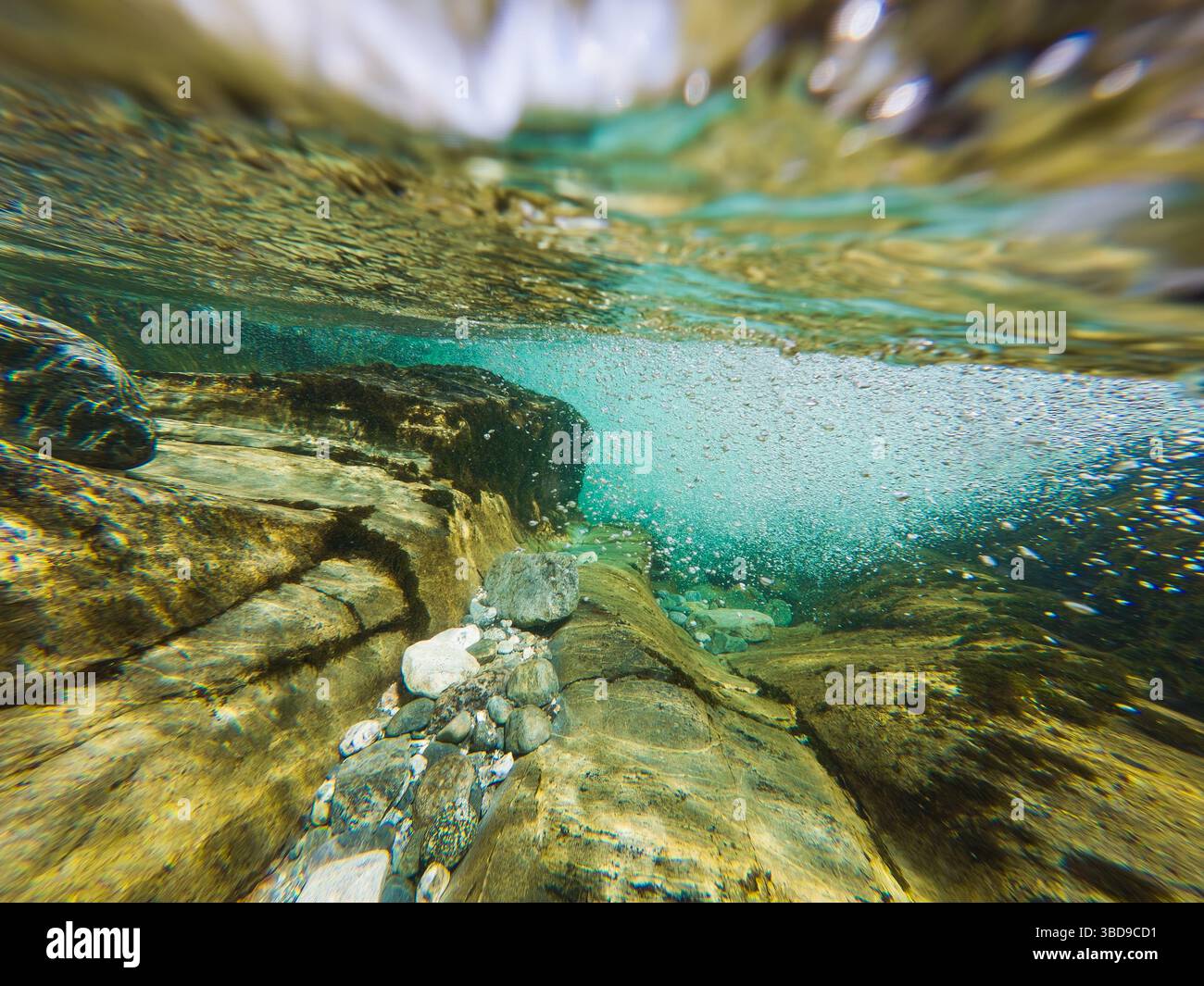 Underwater world of a crystal clear mountain river in Norway: sun rays ...