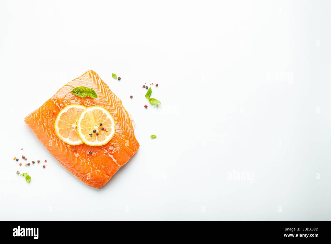 Fresh raw salmon marbled fillet isolated on white background with lemon ...