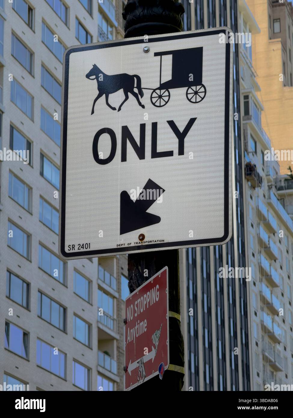 Traffic sign indicating a special lane for horse-drawn carriages, Central Park South, New York City, New York, USA - Smartphone Captured Stock Image