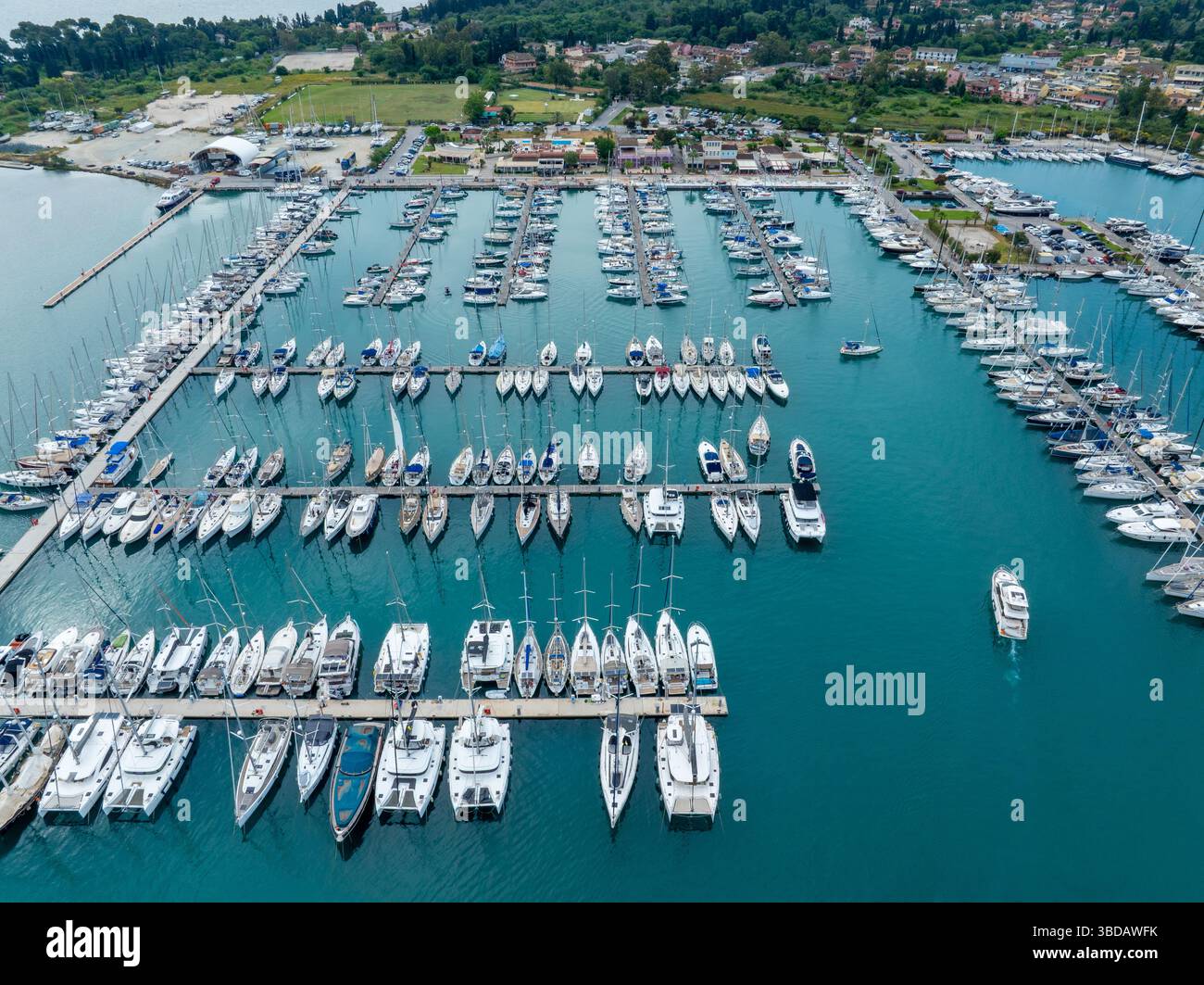 Aerial view of a marina filled with many different types of boats ...