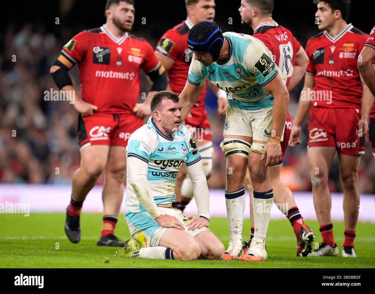 Bath's Quinn Roux checks on Ben Spencer after he scores a try during ...