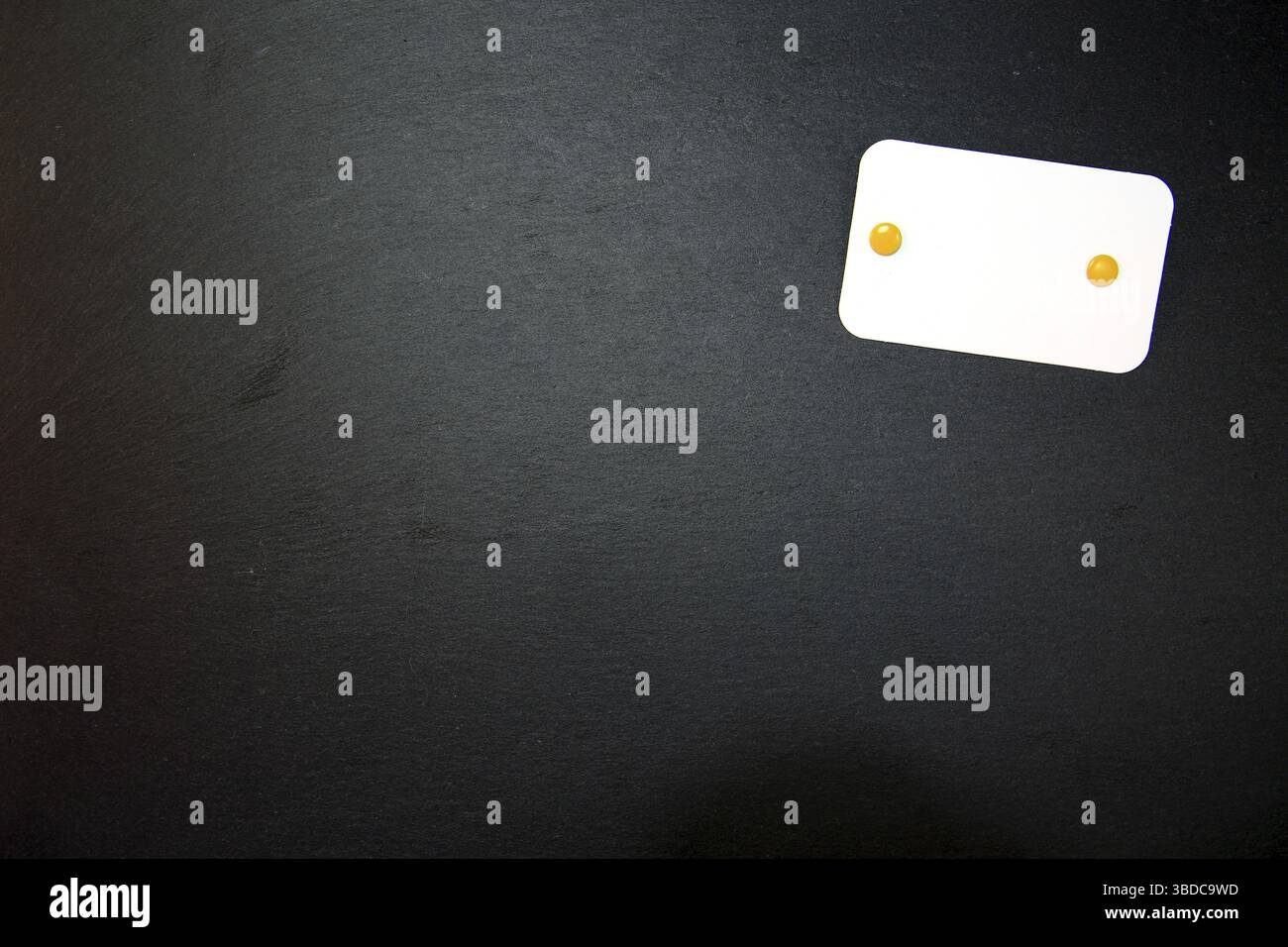 Black slate with white field for notes Blackboard (slate) with blank, writable notepad Stock Photo