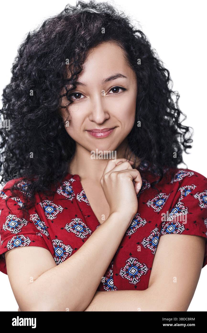 Young happy woman with curly black hair over white background Stock Photo