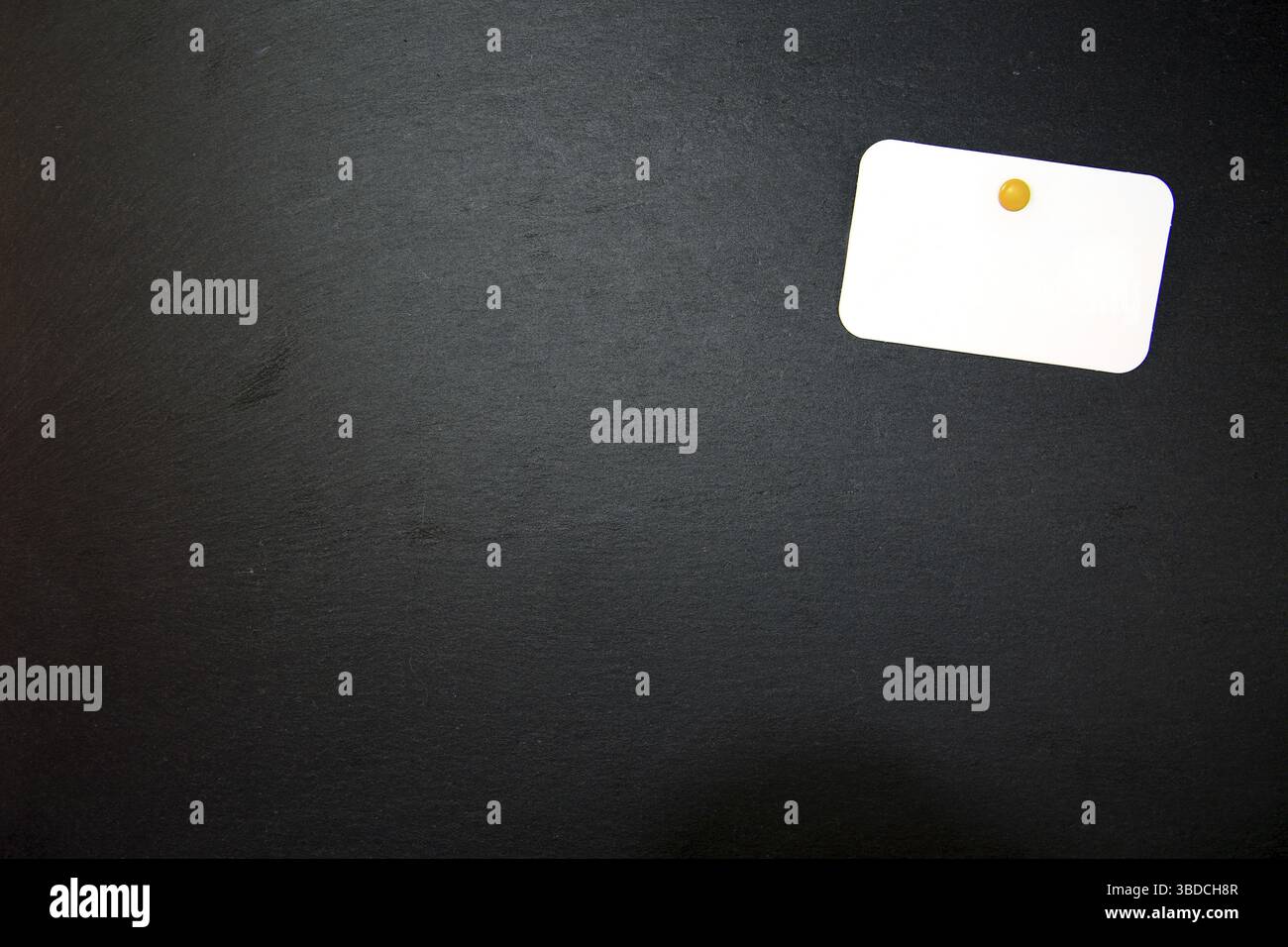Black slate with white field for notes Blackboard (slate) with blank, writable notepad Stock Photo