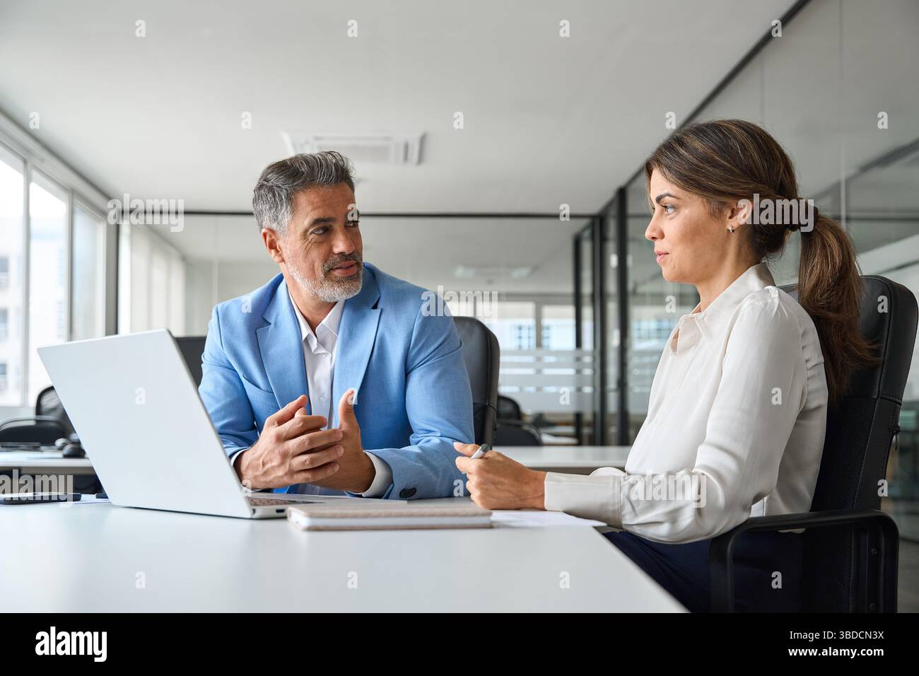 Two busy professional executive team business people working together. Stock Photo