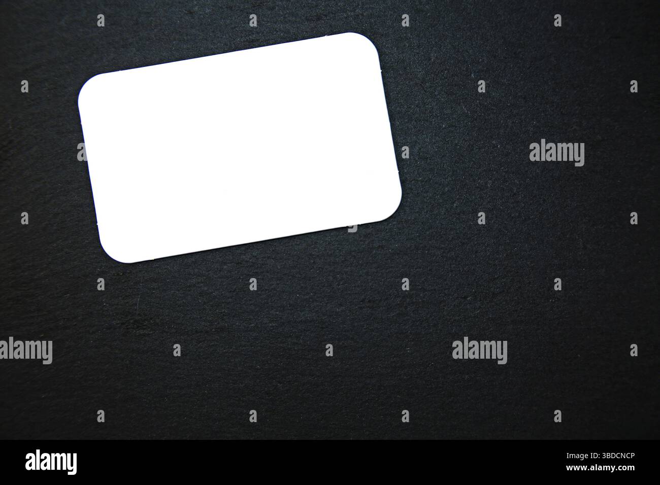 Black slate with white field for notes Blackboard (slate) with blank, writable notepad Stock Photo