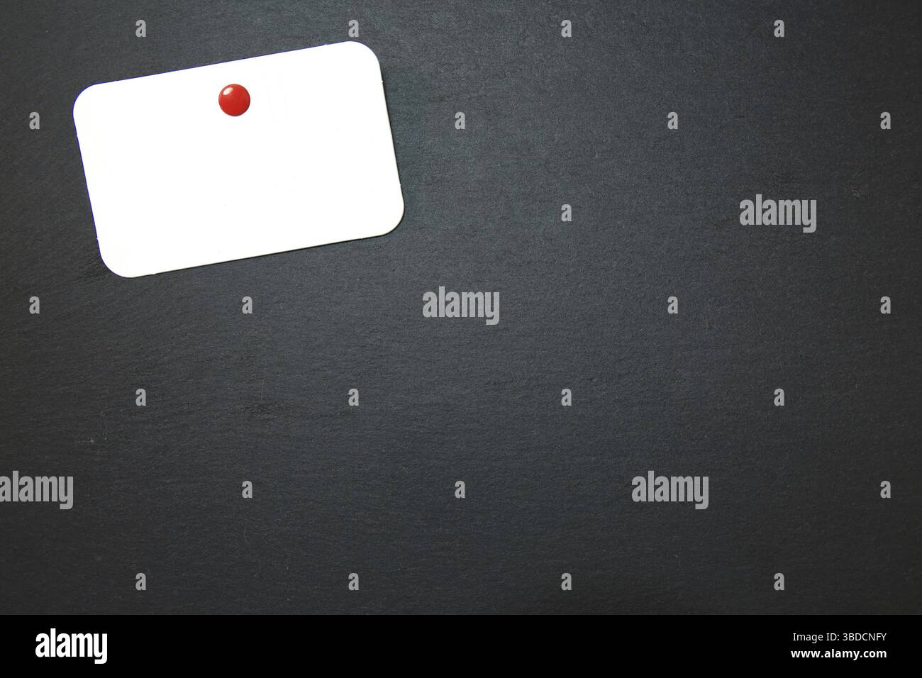Black slate with white field for notes Blackboard (slate) with blank, writable notepad Stock Photo