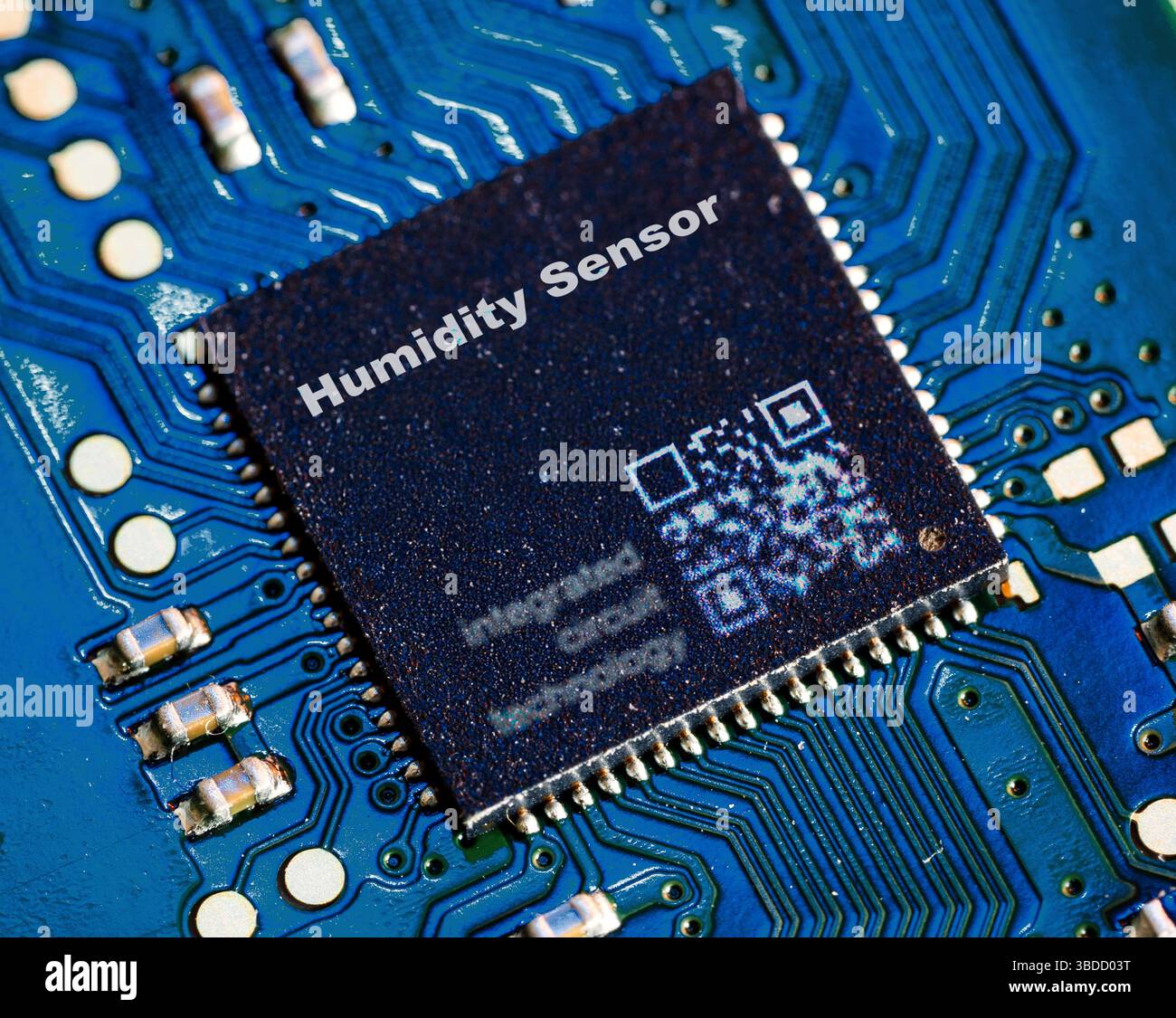 Humidity sensor. Microchip for measuring environmental humidity. Stock Photo