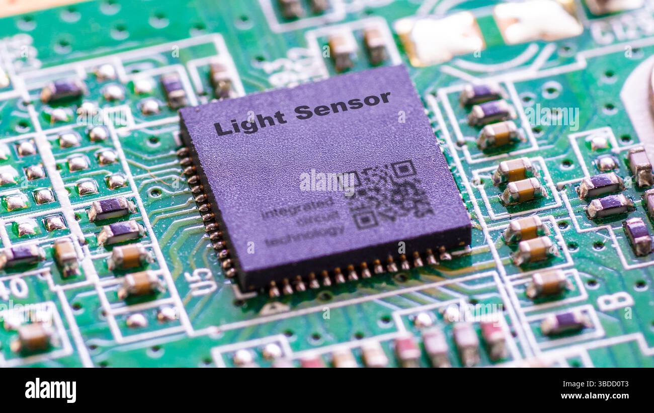 Light sensor. Microchip for measuring ambient light levels. Stock Photo