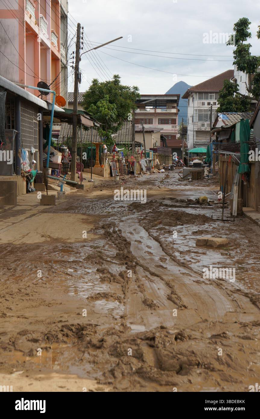 Maesai, Chiangrai, Thailand. 24th May 2025. Mud flows into a road in a ...