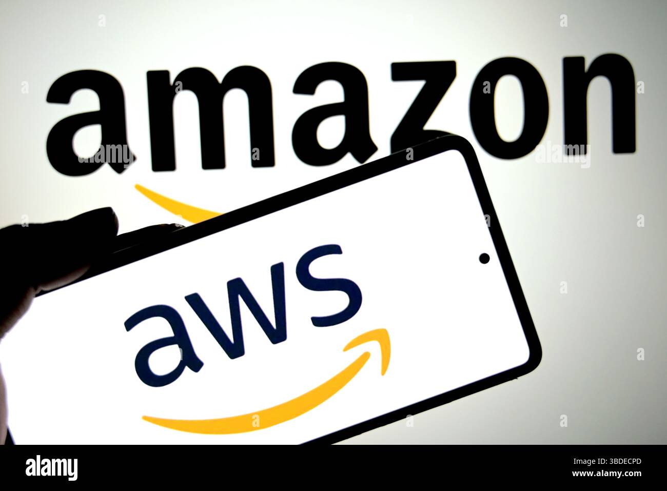 In this photo illustration, an AWS(Amazon web service) logo is seen displayed on a smartphone with an Amazon logo in the background. (Photo by Avishek Das / SOPA Images/Sipa USA) *** Strictly for editorial news purposes only *** Stock Photo
