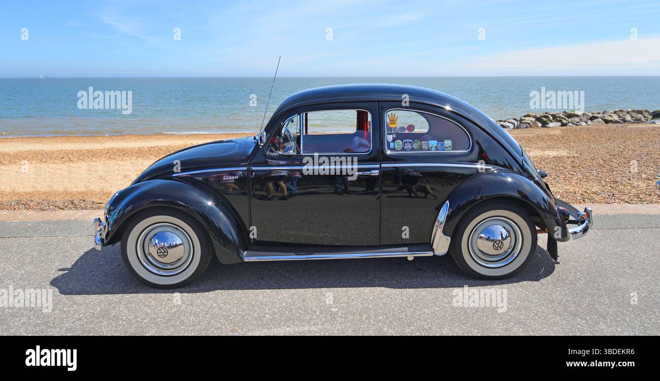 Classic Blue Volkswagen Beetle parked on seafront promenade beach and ...