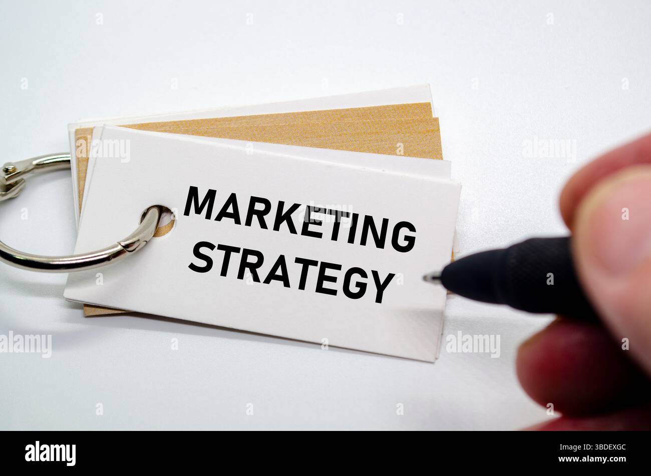 Strategic marketing plan text shown on white notepad for brand growth and audience reach Stock Photo