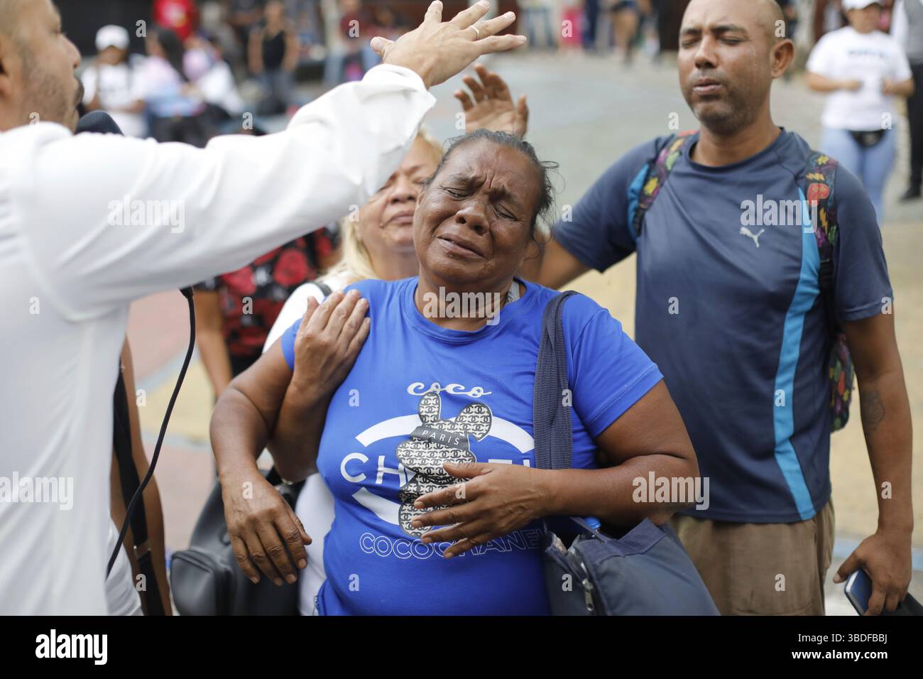 Pastor Siro Salazar, left, prays over congregant with a laying of hands ...