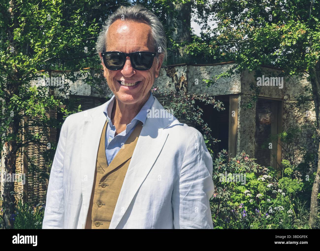Richard E. Grant, British actor, smiling at Chelsea Flower Show, London ...