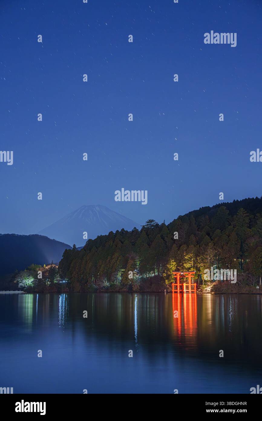 A scenic view of red torii gate of Hakone Shrine at night.The japanese ...
