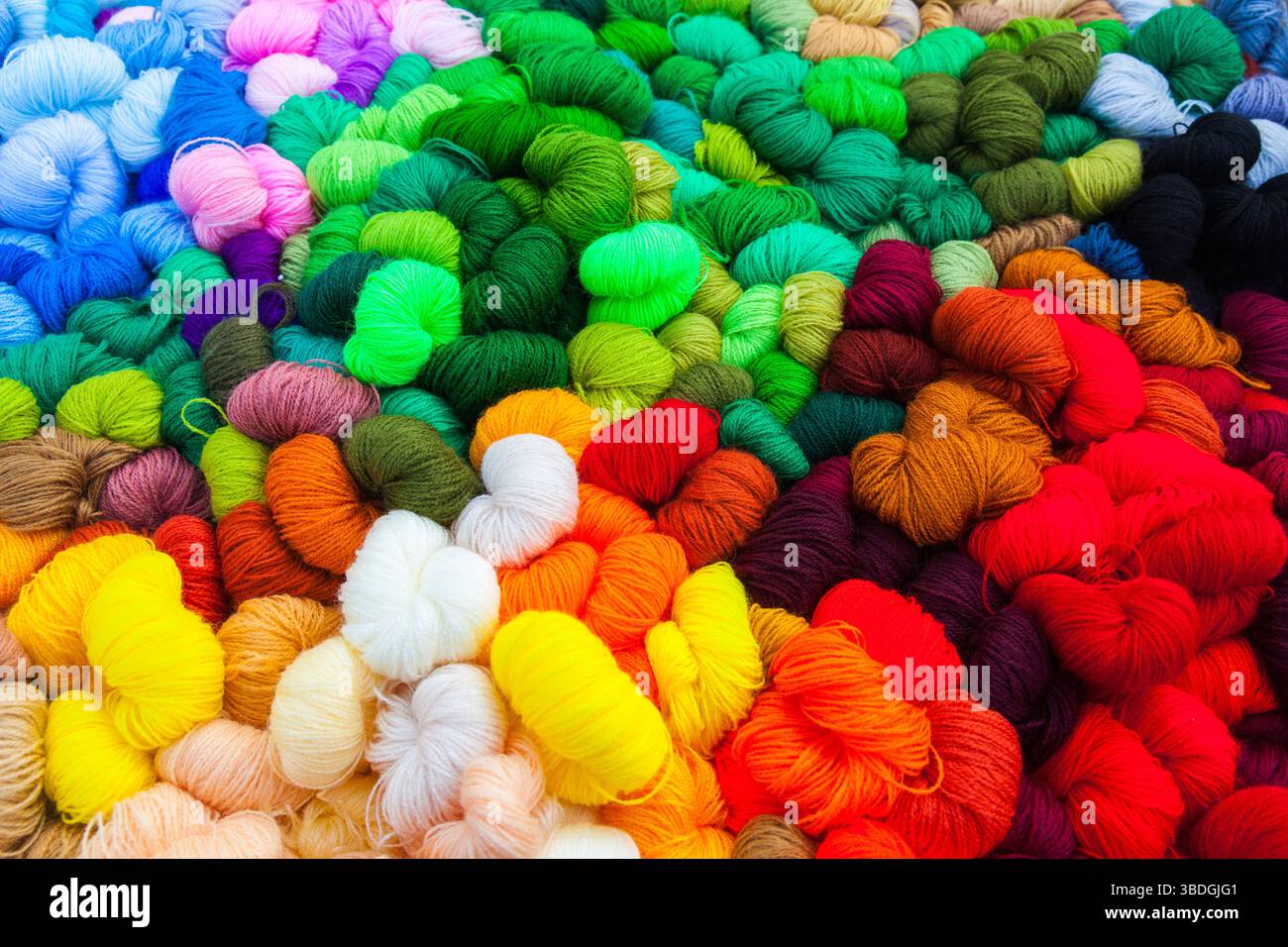 Yarn. Background from multi-colored threads for knitting closeup. Stock Photo