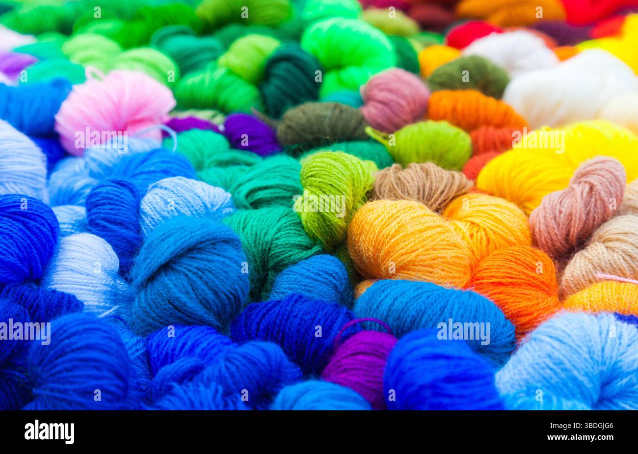 Yarn. Background from multi-colored threads for knitting closeup. Stock Photo