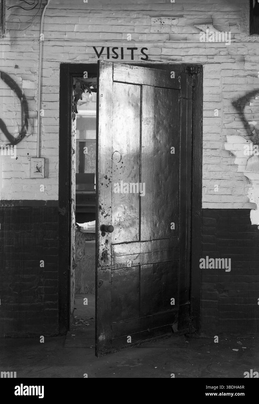 Visitors door in abandoned prison Stock Photo
