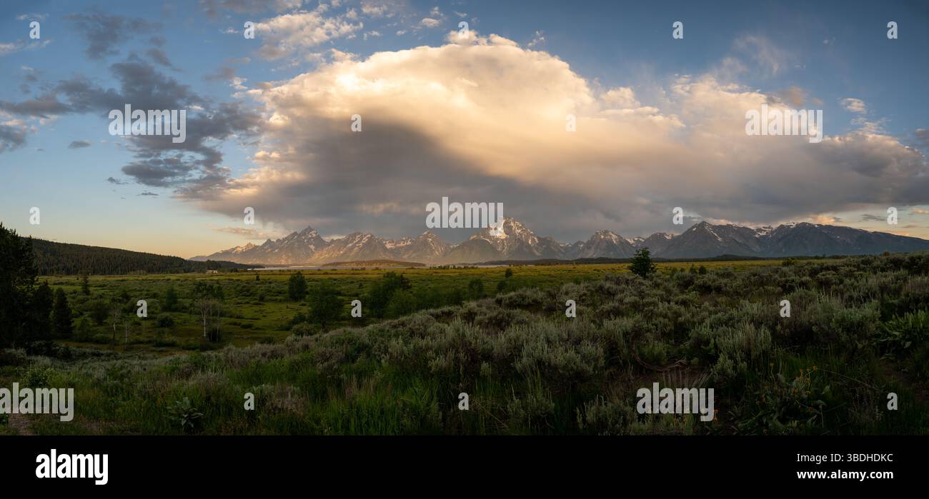 Large Cloud Formation Over The Grand Teton Range in early summer Stock Photo