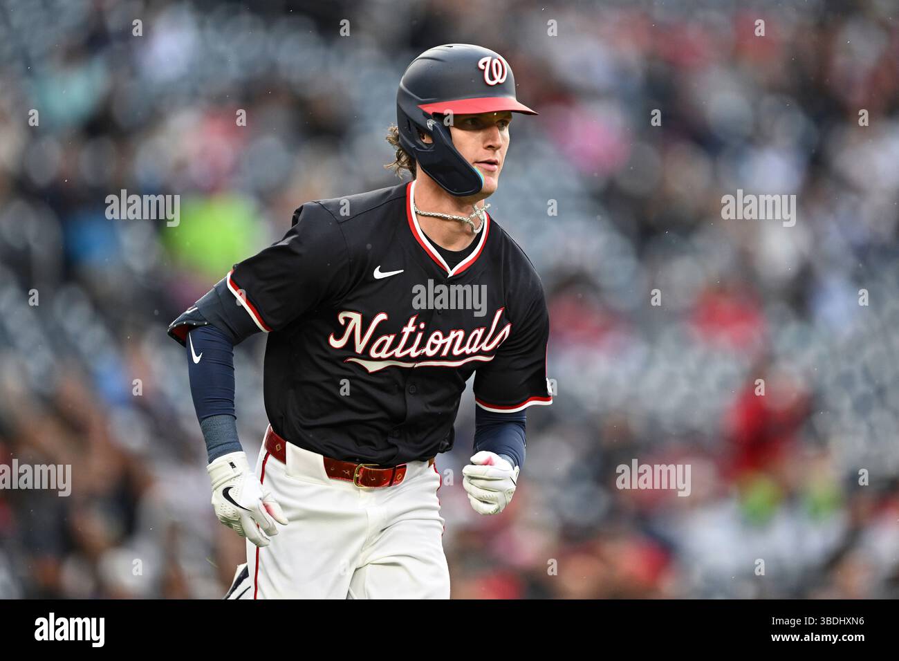 Rob Hassel Washington Nationals' Robert Hassell III run after hitting a single for ...