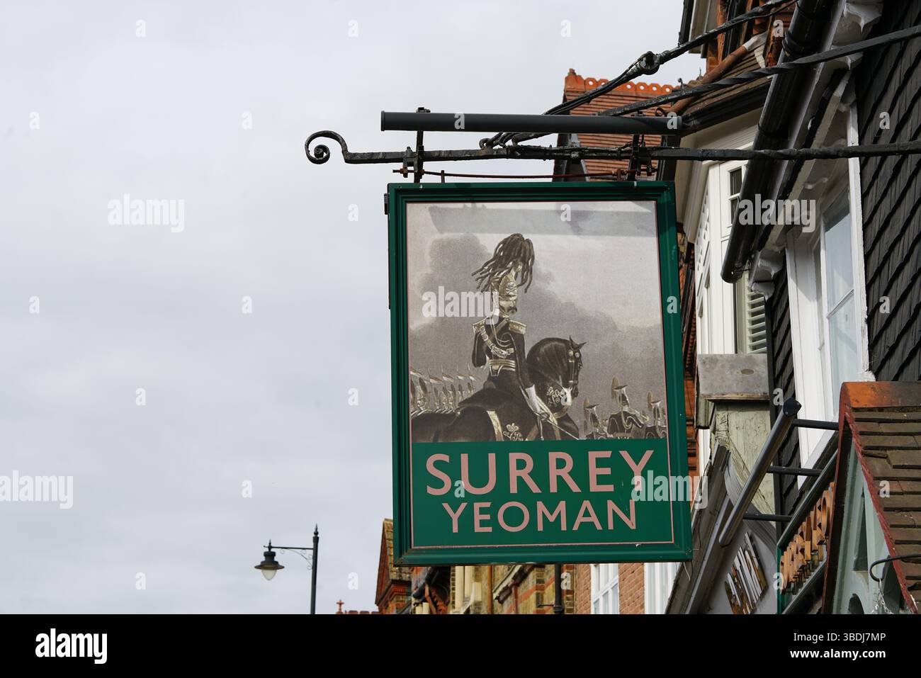 Historical Pub Sign Featuring Illustration of Surrey Yeoman in Traditional Attire. Dorking, UK Stock Photo
