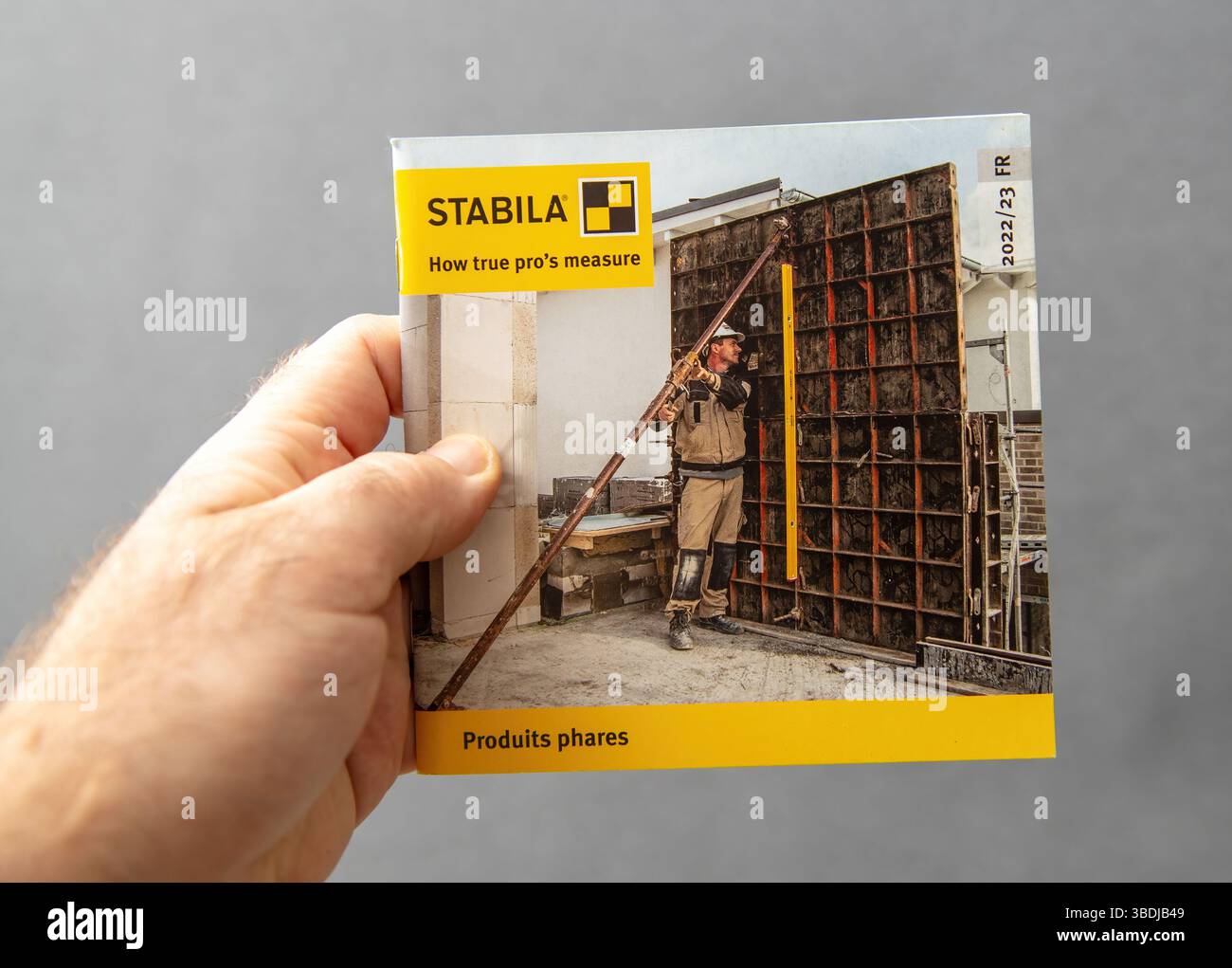 Paris, France - Mar 10, 2025: Hand holding a STABILA catalog featuring ...