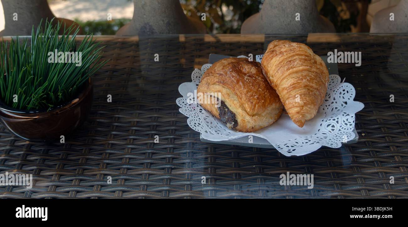Pastries on plate on table Stock Photo