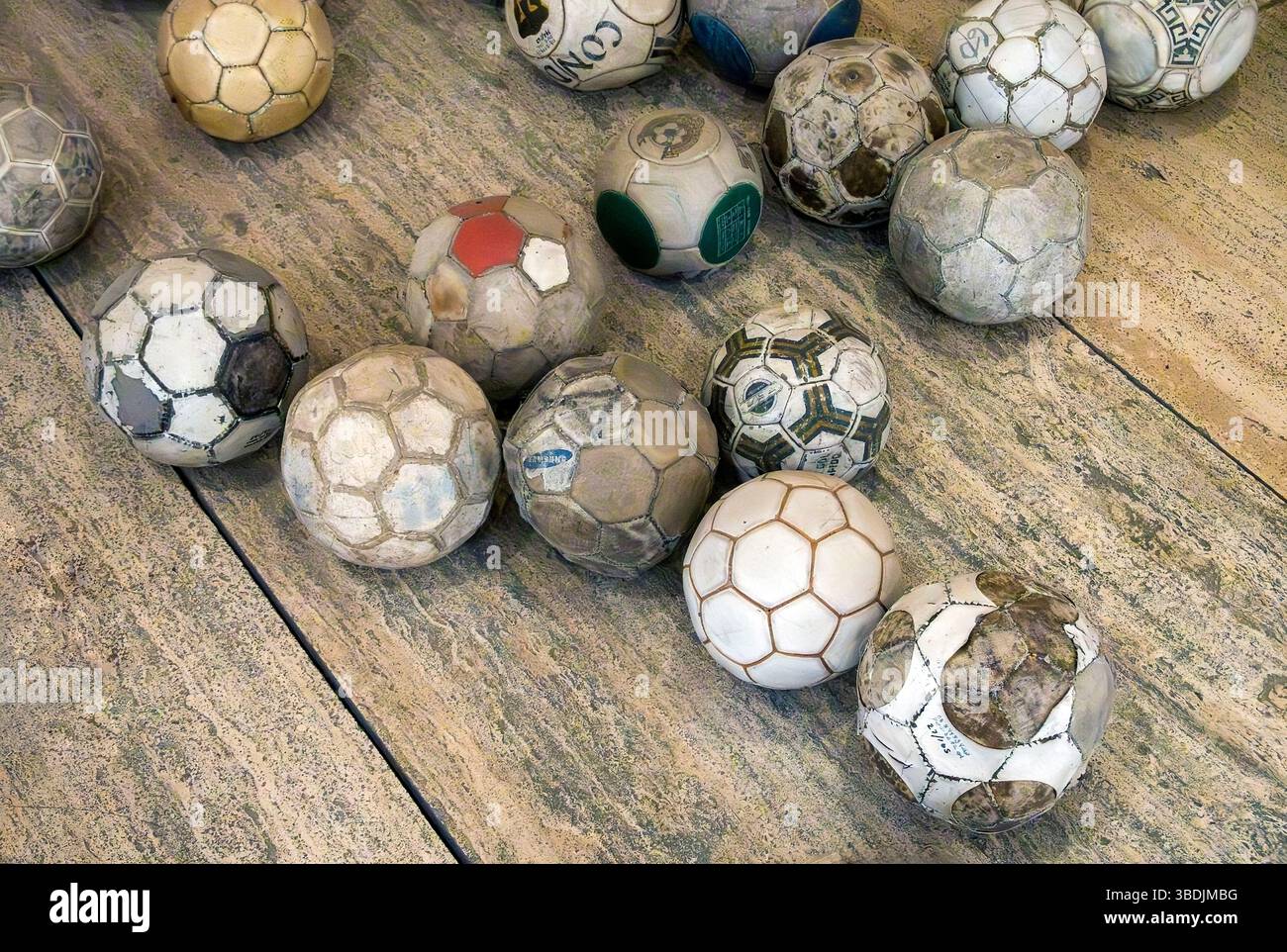 Vintage leather soccer balls in art installation by Mexican artist Gabriel Orozco  in the Jumex Museum, Mexico City, Mexico Stock Photo