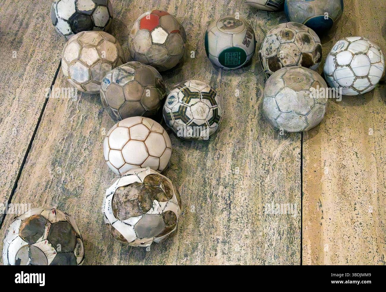 Vintage leather soccer balls in art installation by Mexican artist Gabriel Orozco  in the Jumex Museum, Mexico City, Mexico Stock Photo