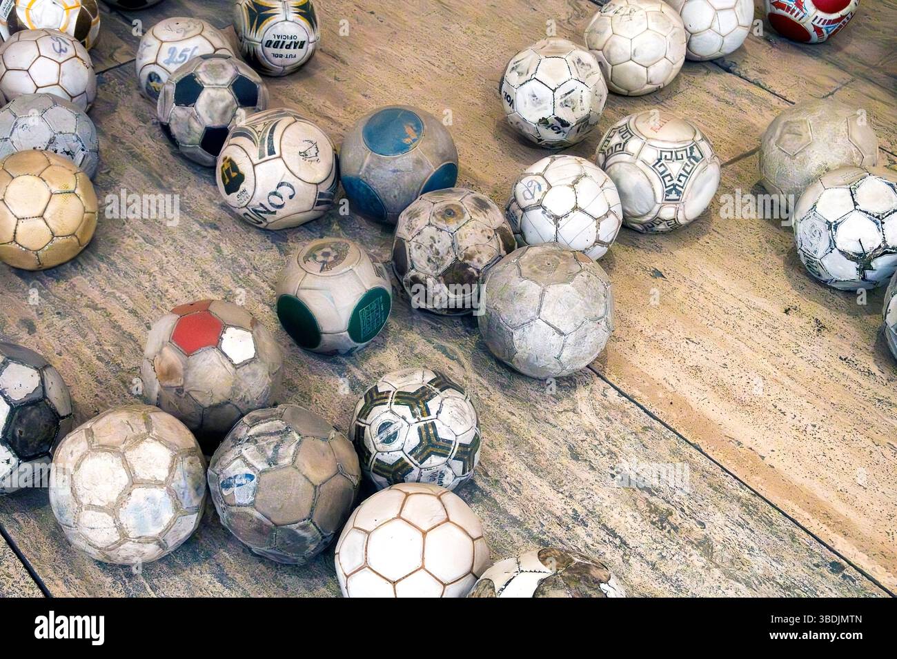 Vintage leather soccer balls in art installation by Mexican artist Gabriel Orozco  in the Jumex Museum, Mexico City, Mexico Stock Photo
