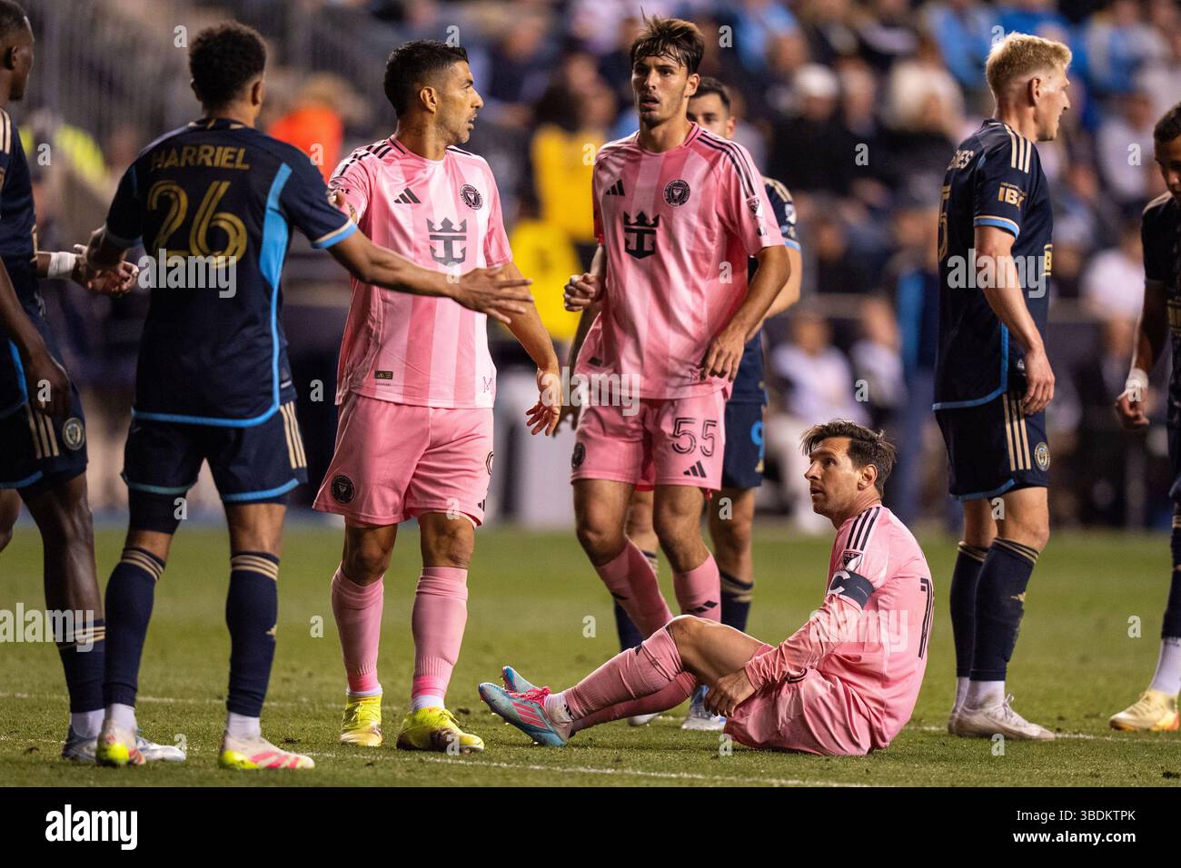 Inter Miami's Lionel Messi, second from right, looks up after taking a ...