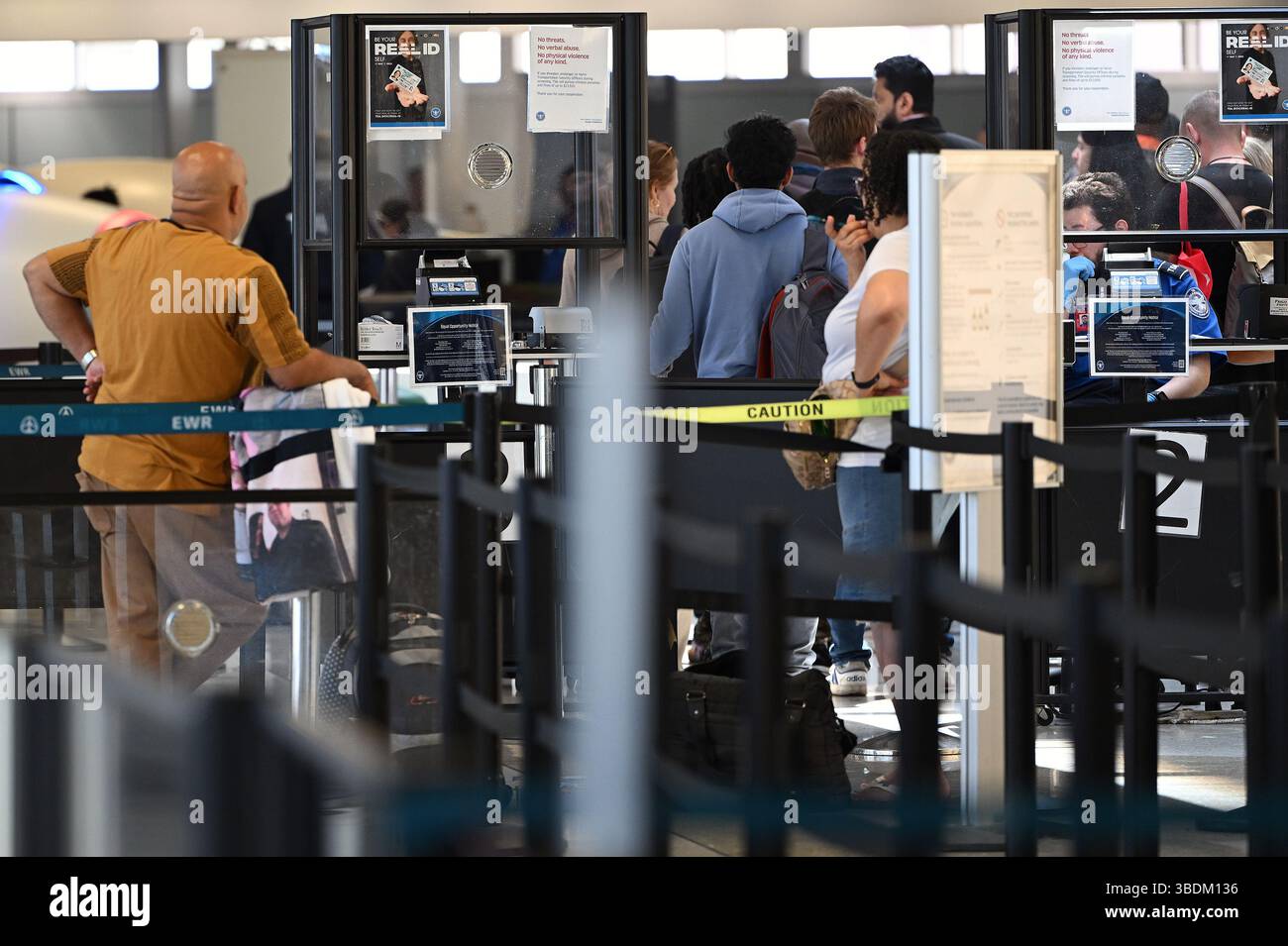 New York, USA. 24th May, 2025. Passengers prepare for TSA check point