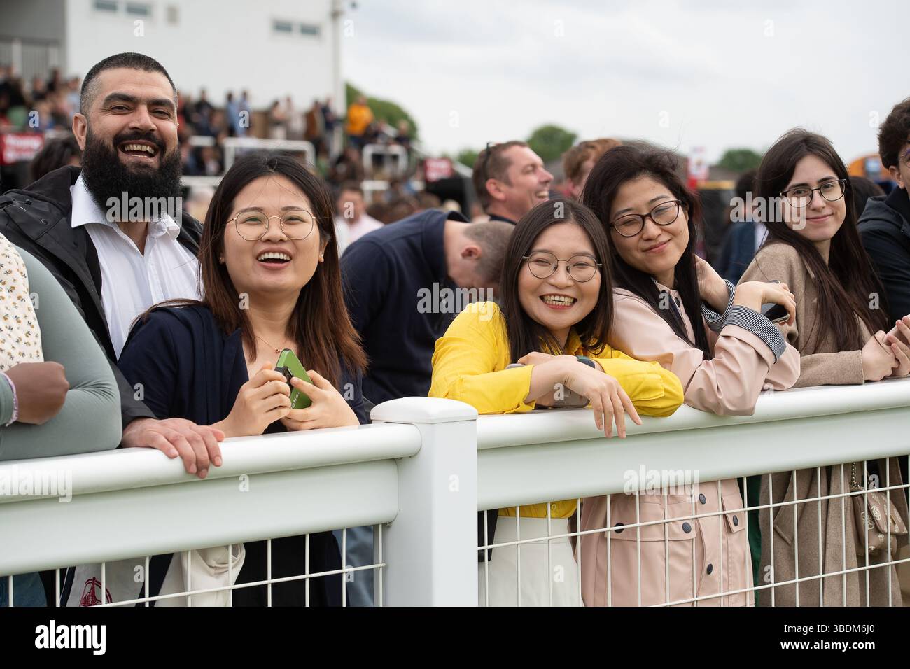 Windsor, Berkshire, UK. 24th May, 2025. It was a cooler evening in Windsor but the rain held off as racegoers enjoyed a busy  Royal Windsor's Summer Opening Party Racenight at Royal Windsor Racecourse in Windsor, Berkshire and the Live DJ set after racing with DJ Marvin Humes. Credit: Maureen McLean/Alamy Live News Stock Photo