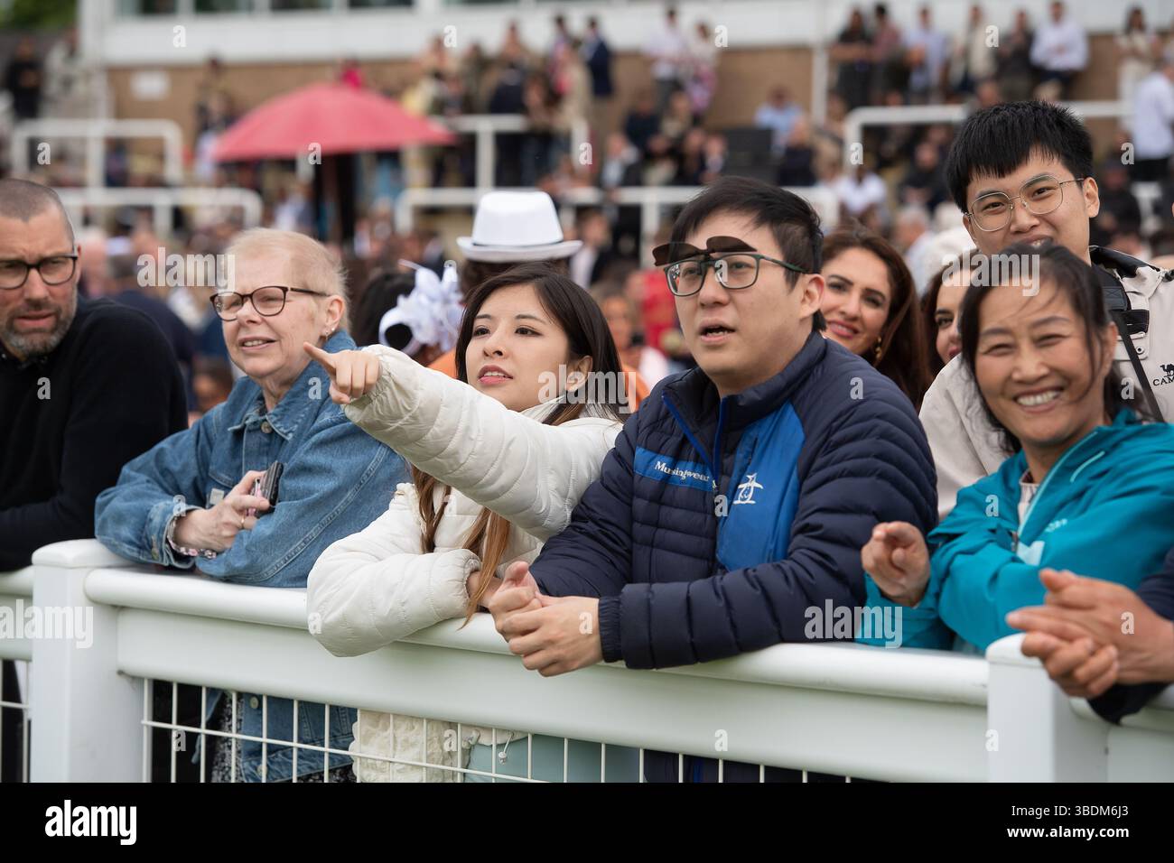 Windsor, Berkshire, UK. 24th May, 2025. It was a cooler evening in Windsor but the rain held off as racegoers enjoyed a busy  Royal Windsor's Summer Opening Party Racenight at Royal Windsor Racecourse in Windsor, Berkshire and the Live DJ set after racing with DJ Marvin Humes. Credit: Maureen McLean/Alamy Live News Stock Photo
