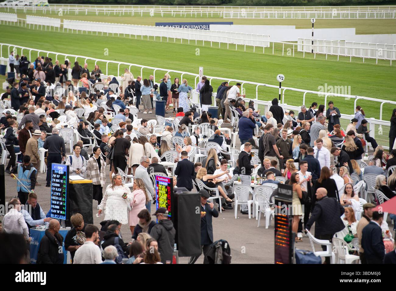 Windsor, Berkshire, UK. 24th May, 2025. It was a cooler evening in Windsor but the rain held off as racegoers enjoyed a busy  Royal Windsor's Summer Opening Party Racenight at Royal Windsor Racecourse in Windsor, Berkshire and the Live DJ set after racing with DJ Marvin Humes. Credit: Maureen McLean/Alamy Live News Stock Photo