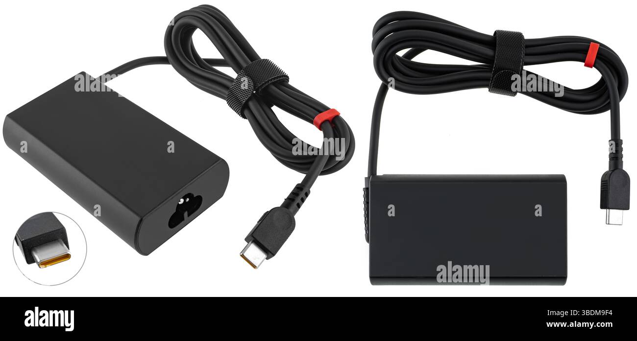 Classic laptop power supply with black cable. Perfect for catalogs and online electronics stores. Stock Photo