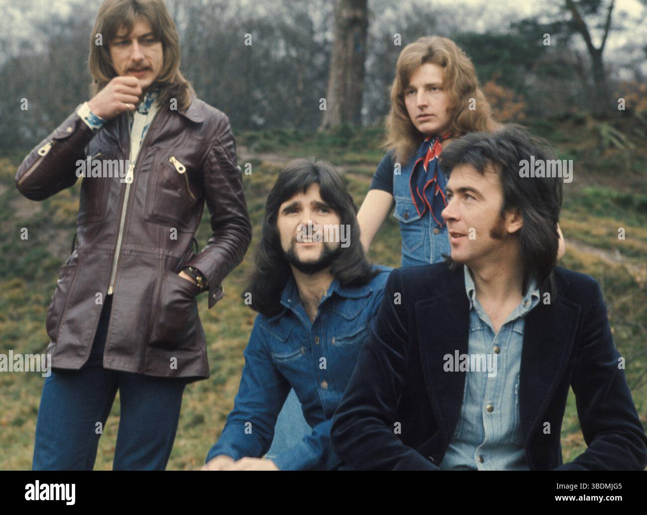 Trapeze became a quartet in 1974 after Glenn Hughes had left to join Deep Purple. Mel Galley on lead vocals and guitar (right), Dave Holland on drums (left) with second guitarist Rob Kendrick and bassist Pete Wright.  This line up cut the album Hot Wire which was their first to chart.  Two years later they reformed with Glenn Hughes. Stock Photo