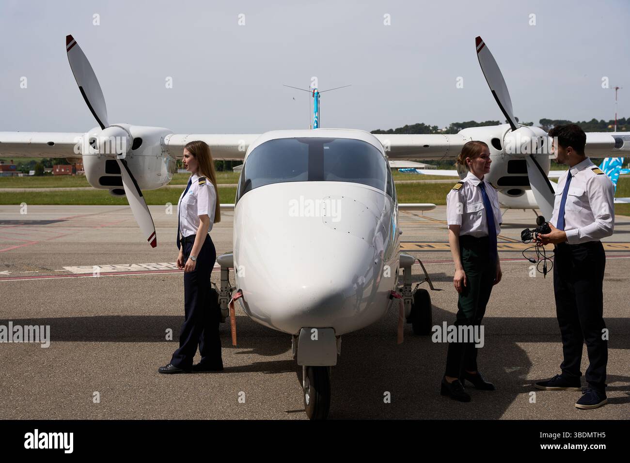 Flight school students preparing twin-engine aircraft for takeoff Stock ...
