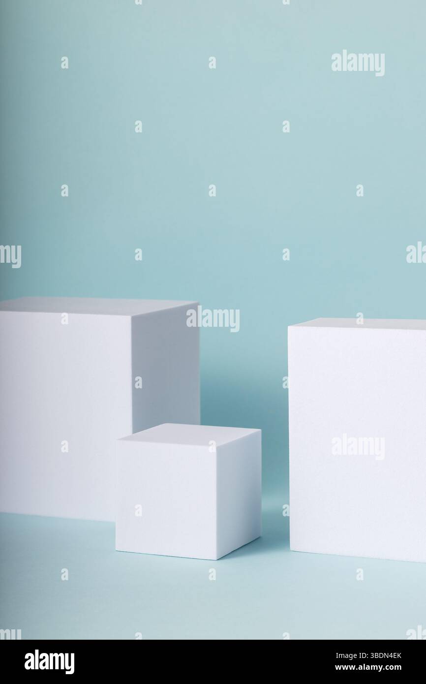 Showcase stands for online marketing. Minimal concept with white cubes on blue background. Stock Photo